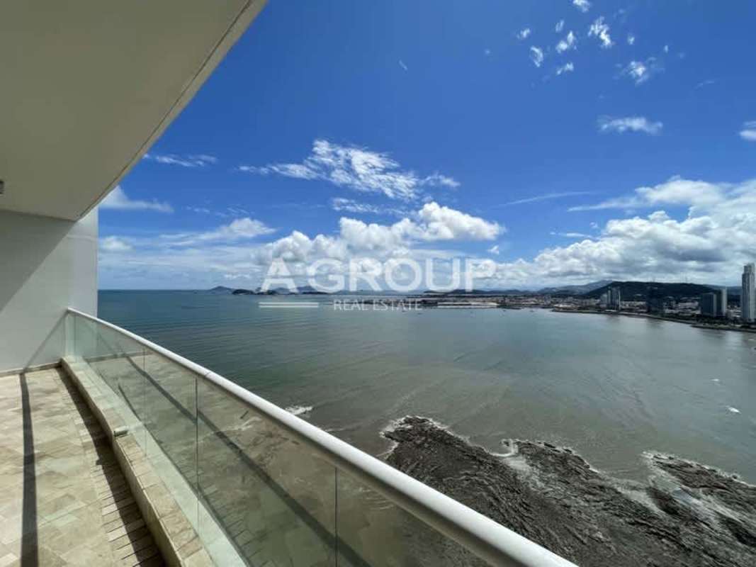 Contemporary kitchen with granite countertops, wood cabinets and sea view in The Point Punta Paitilla