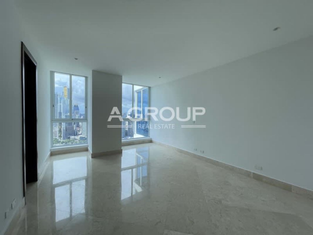 Luxury waterfront infinity pool with views of city skyline and ocean at The Point tower in Panama City