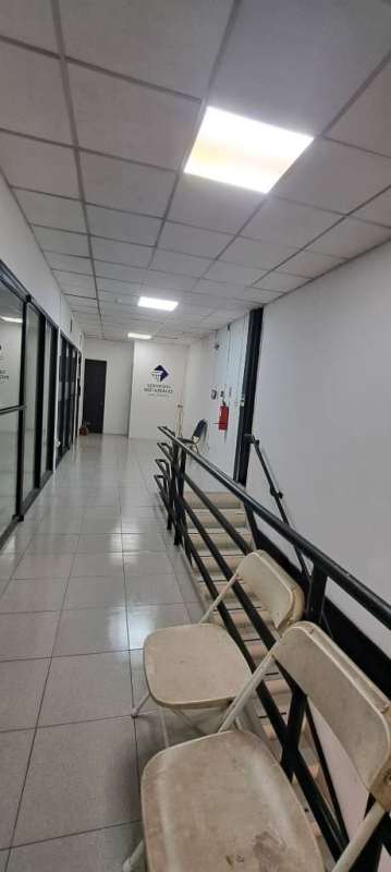 Modern commercial hallway with glass panel offices inside Centro Comercial Los Andes Panama City