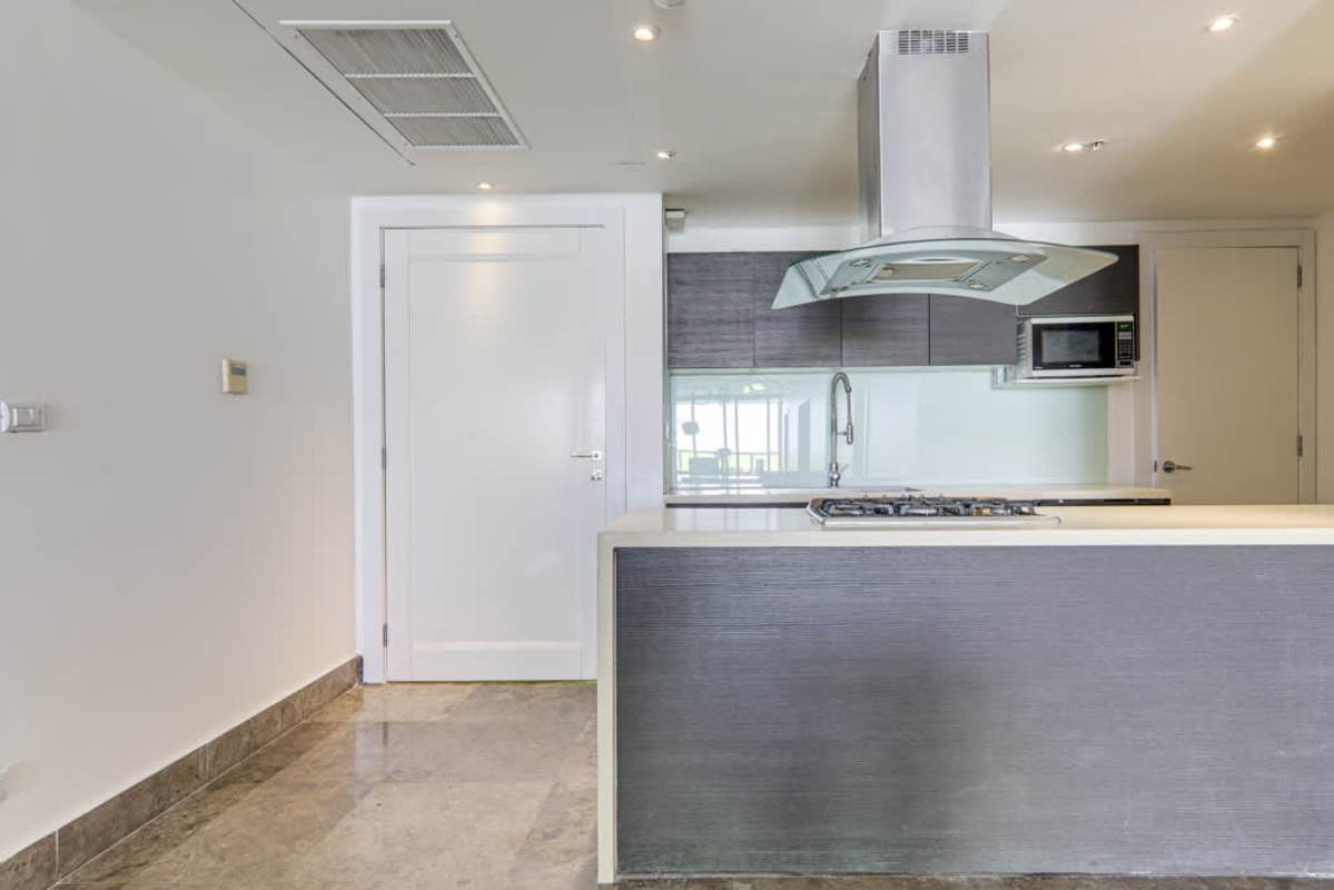 Spacious master bedroom with city and ocean views in YOO Panama apartment