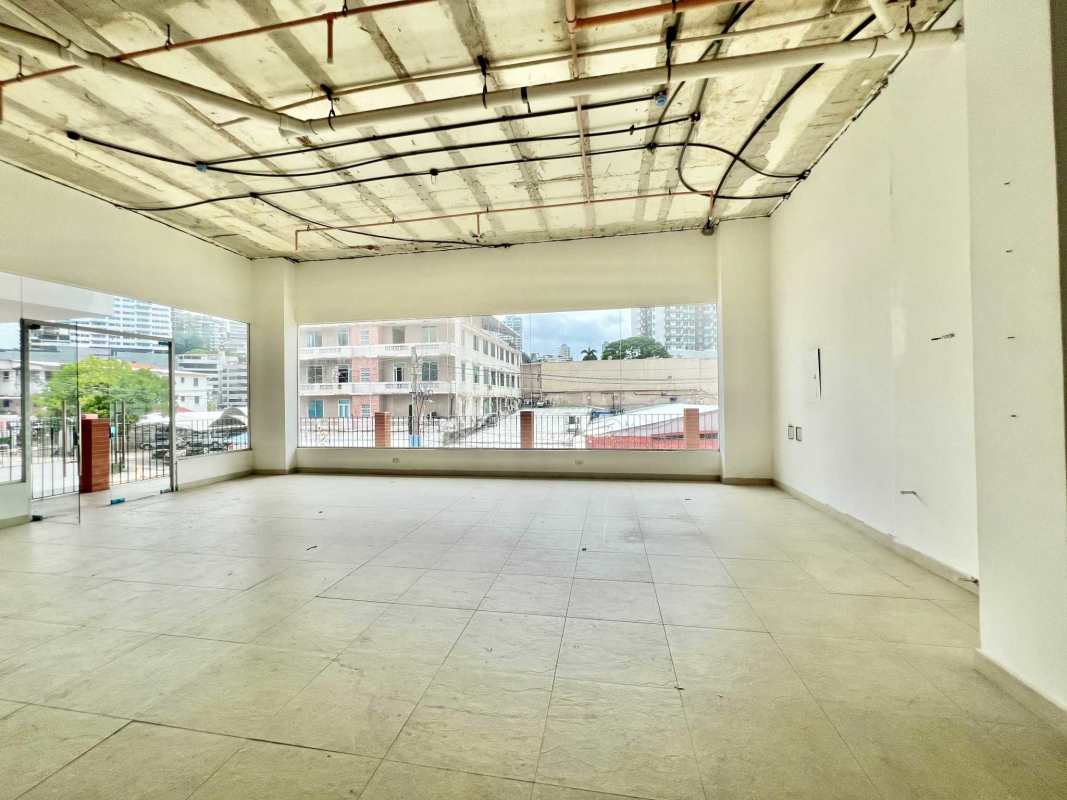Large empty unfinished commercial space exposed ceiling large windows Plaza Bella Vista Panama City