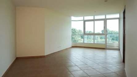 Large bedroom with window overlooking golf course and ocean at Coronado Golf Tower Panama