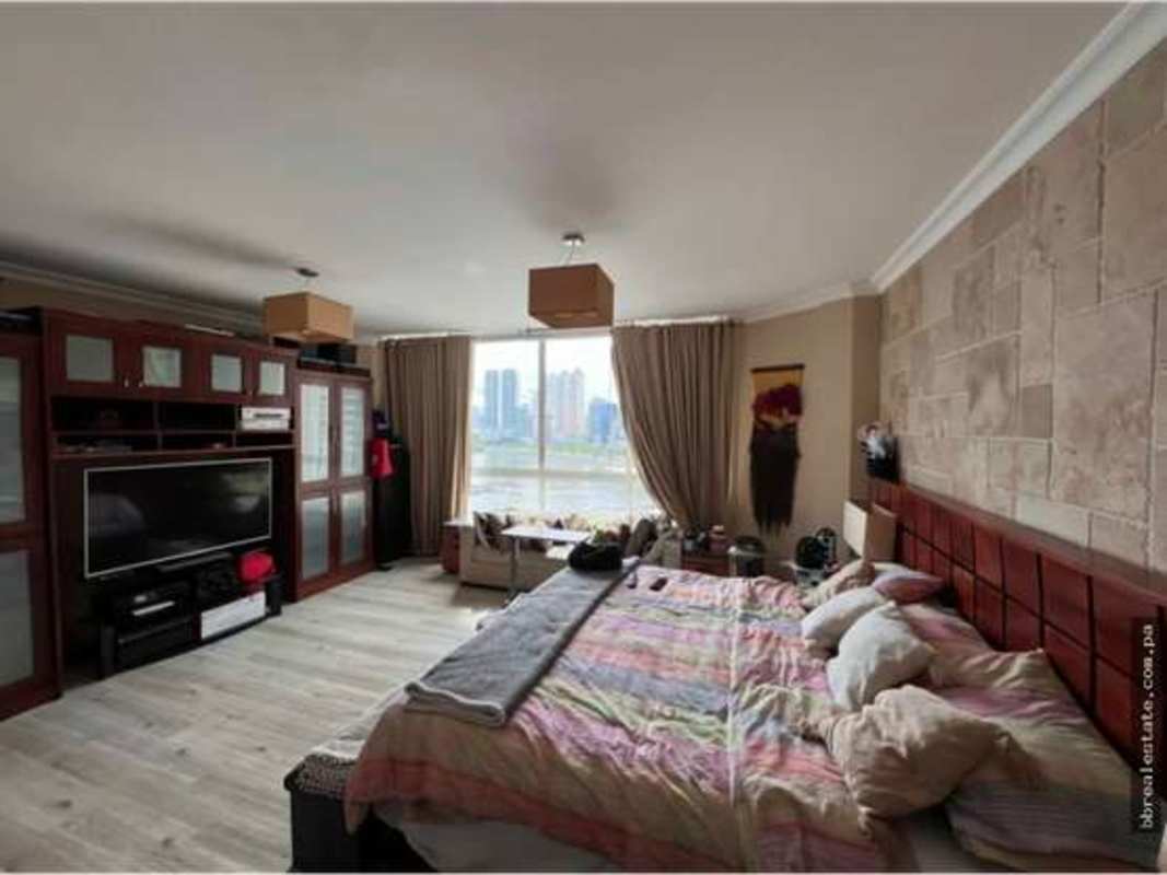 Bright bedroom with city skyline views in PH Peninsula condominium Punta Paitilla Panama