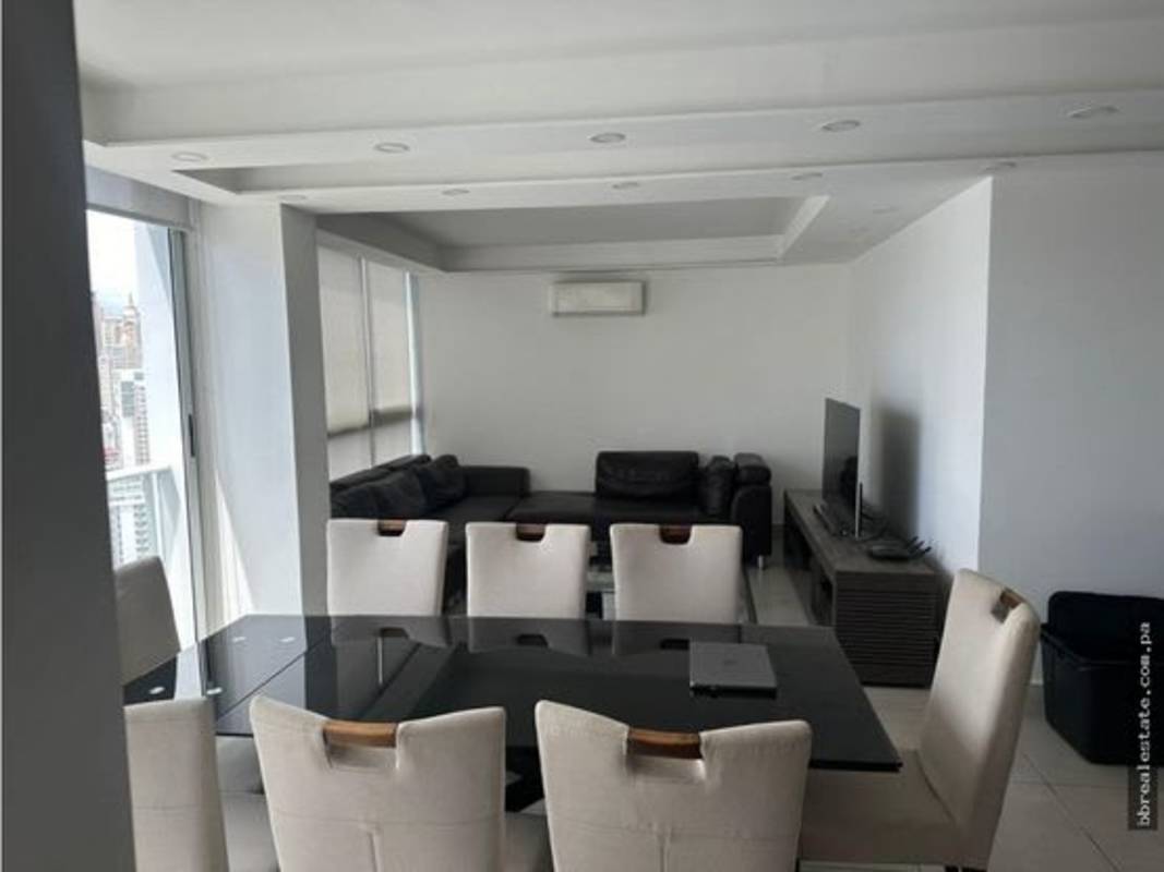 Modern living and dining area with glass table sofa city view PH Park City Panama