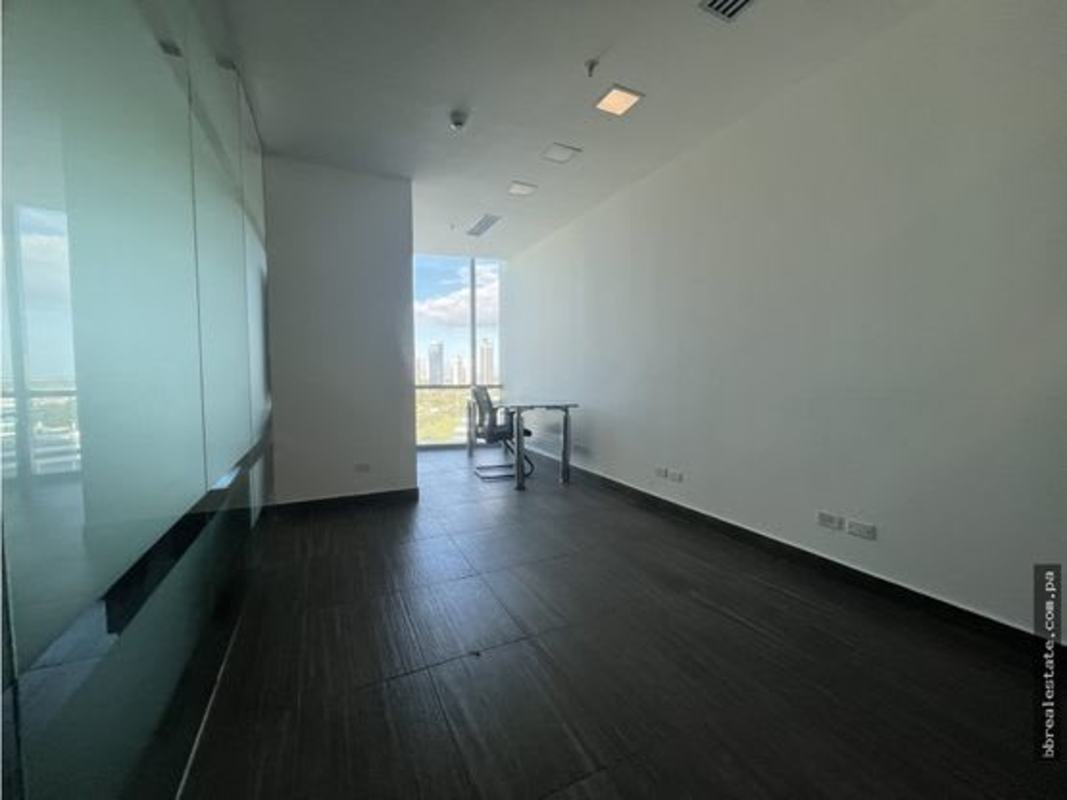 Private office with glass desk large window overlooking Costa del Este Panama