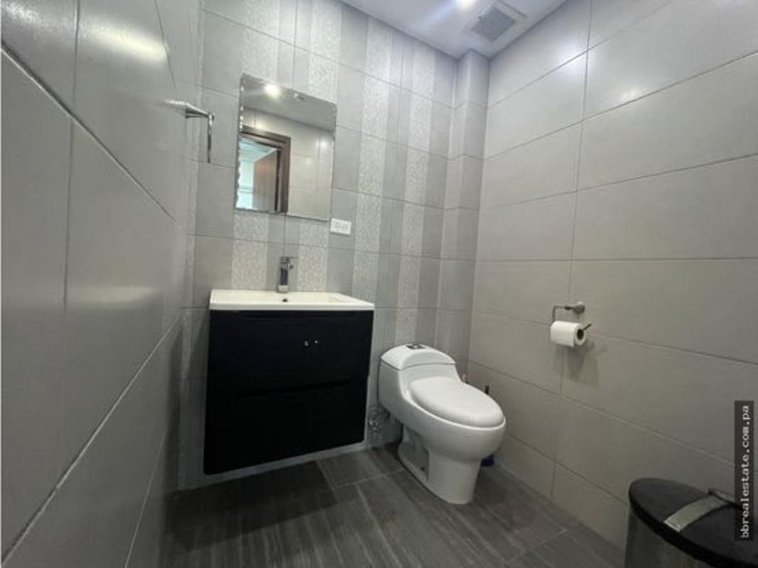 Hallway with kitchenette fridge tile floor inside office Financial Park Tower Panama