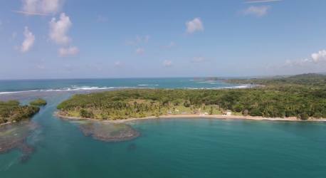 Lush green coastal peninsula with oceanfront ideal for hotel and villa development