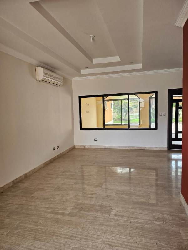 Sunroom with arched windows, yellow walls and tile floors Sunset Coast Costa Sur Panama