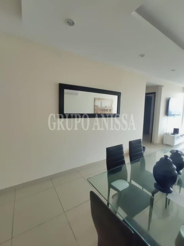 Spacious master bedroom with walk-in closet, furniture and city view balcony in PH Midrise Panama