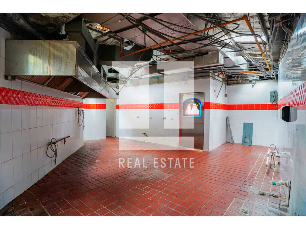 Restaurant bar area with rustic beams tiled floors stone accents Panama City commercial property