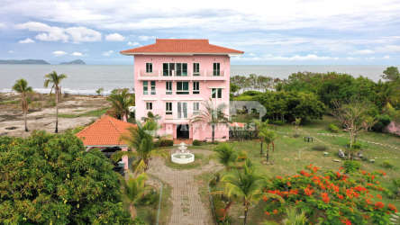 Mediterranean design pink beachfront mansion with lush gardens ocean view Punta Chame Panama
