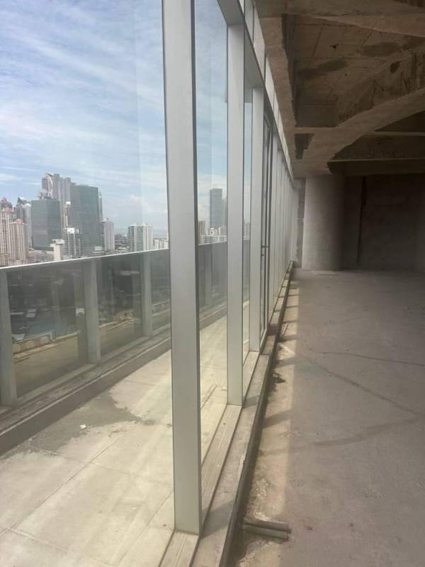 Unfinished open shell office for sale in F&F Tower with concrete floor and city skyline views Panama City