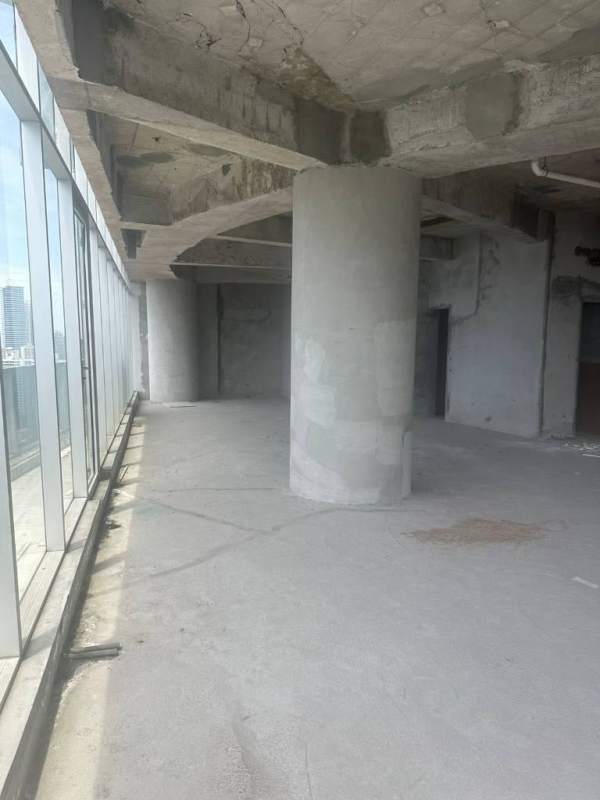 Large open unfinished commercial office space with floor-to-ceiling windows in F&F Tower Panama City