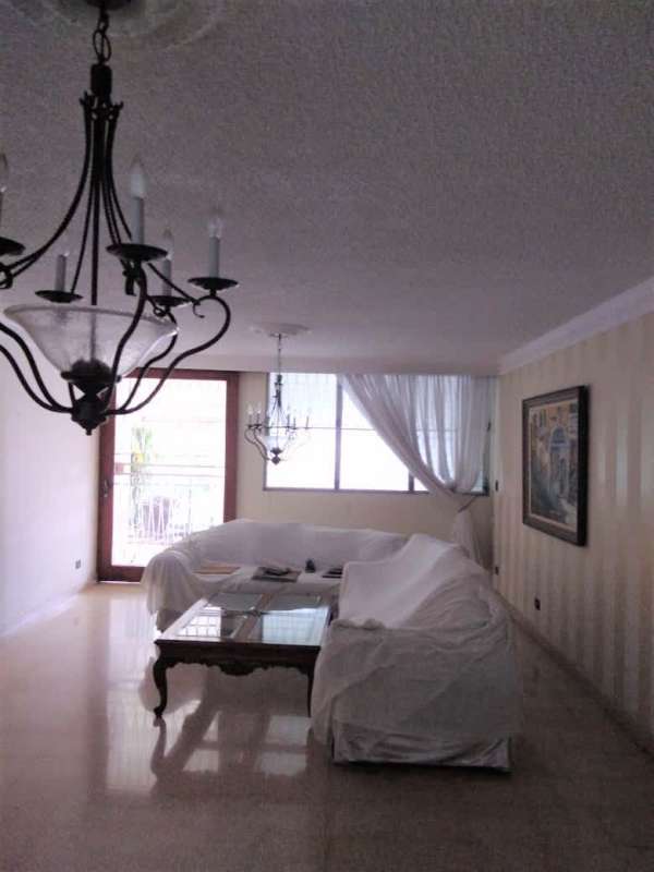 Spacious living room with large windows curtains chandeliers PH Gina Obarrio Panama