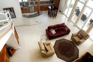 Mediterranean villa with lush gardens gabled roof and fountain Punta Barco Village Panama