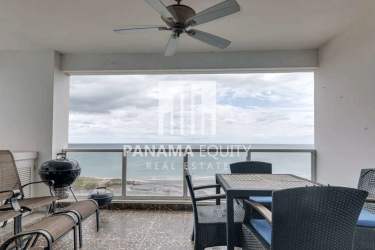 Open living room with glass doors to balcony and ocean views PH Terrazas de Farallón Playa Blanca Panama