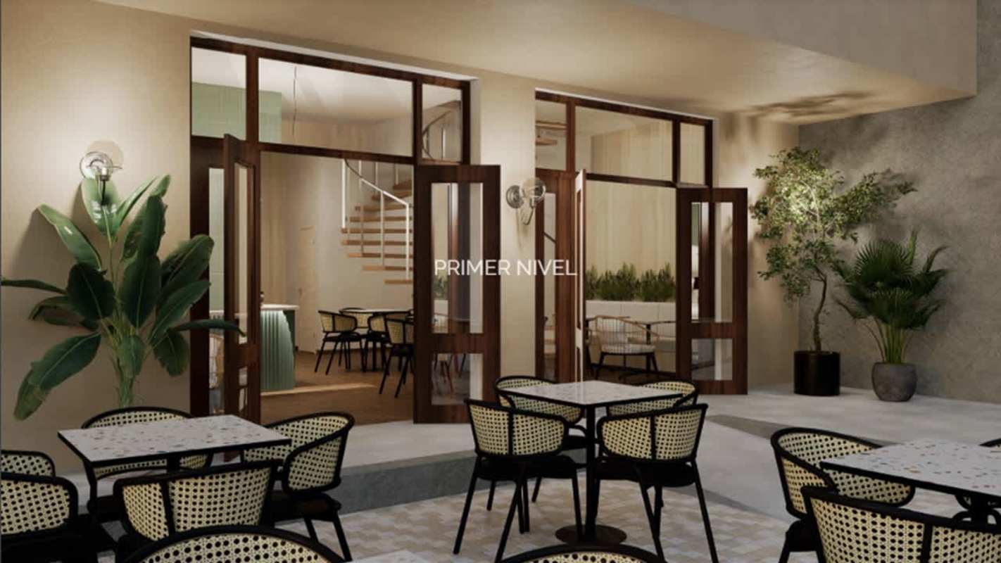 Courtyard patio with wicker furniture, wood windows at historic commercial plaza Panama City