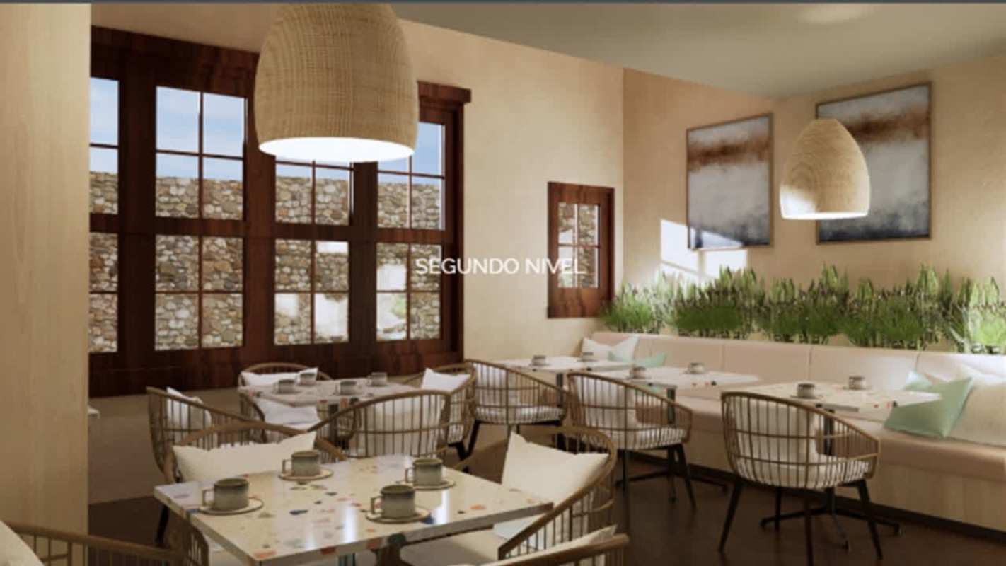 Restaurant dining space with wooden furniture, large windows, rustic decor in Casco Viejo Panama