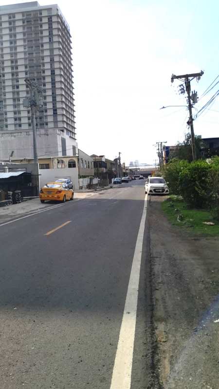 Urban street with residential house front and neighboring lots in Parque Lefevre Panama
