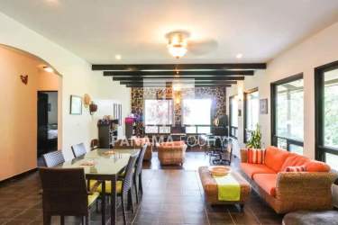 Luxury kitchen with artisan woodwork, large island, natural light in Chica Panama estate