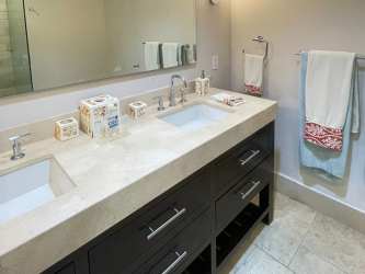 Contemporary bathroom with double vanity and large mirror in Loft Condo Buenaventura Panama