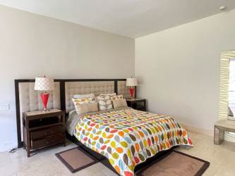 Contemporary bedroom loft with upholstered headboard and balcony Buenaventura