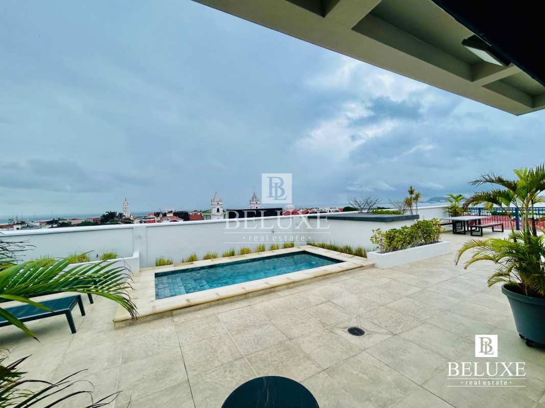 Bedroom with wood floors and walk-in closet in furnished apartment PH Los Portales Casco Viejo Panama