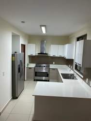 Private enclosed patio with tile floor and garden bed Panama Pacifico River Valley house for sale