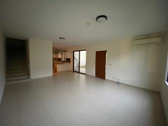 Living room with large tile floors, natural light, staircase in River Valley Panama Pacifico home for sale