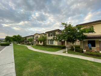 Tiled enclosed patio with greenery at River Valley Panama Pacifico home for sale