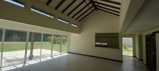 Open living and dining area with garden views tile floors vaulted ceiling Costa Blanca villa Panama