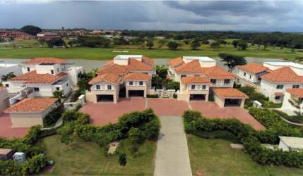 Contemporary kitchen with island and built-in appliances at villa in Ocean Lake Buenaventura Panama