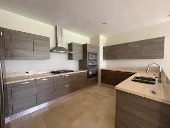 Elegant Mediterranean two-story villas with manicured tropical landscaping in Buenaventura Panama