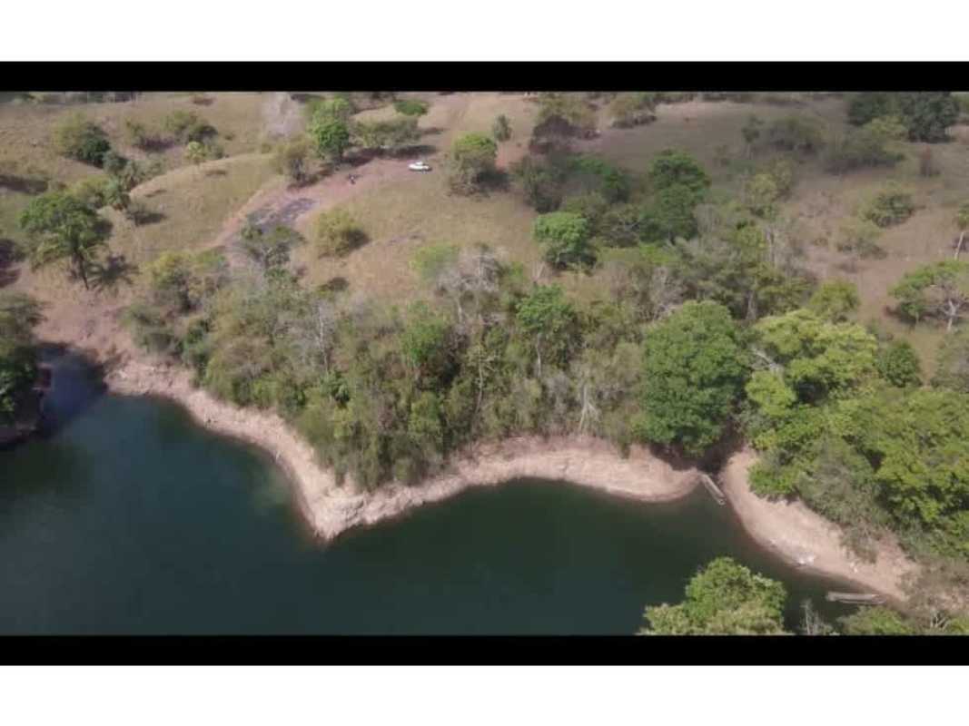 Aerial view of large titled land parcel with wooded hillsides and Bayano Lake frontage Panama