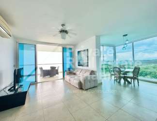 Bright modern living and dining area with large windows and ocean view in Santa Clara Residences