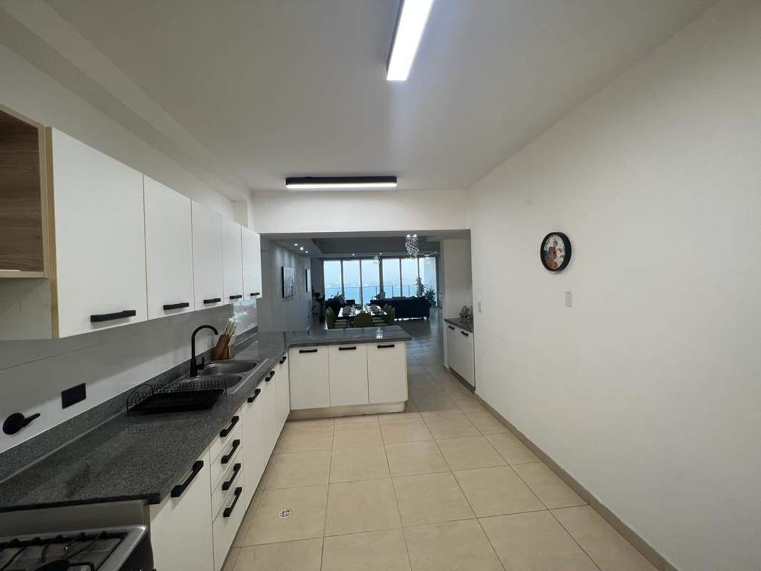 Dining room with floor-to-ceiling windows featuring Pacific Ocean views in Waters on the Bay Panama