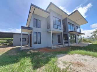 Spacious living room with floor-to-ceiling windows countryside views Penonomé Panama