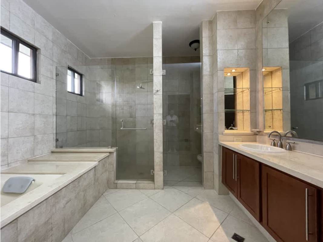 Spacious master suite with balcony overlooking garden in PH Embassy Club Panama