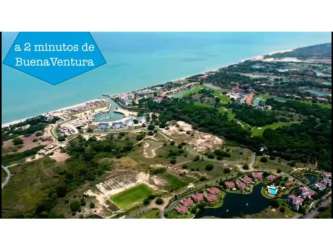Coastal view of real estate near Buenaventura and Playa Blanca with marina and beach area