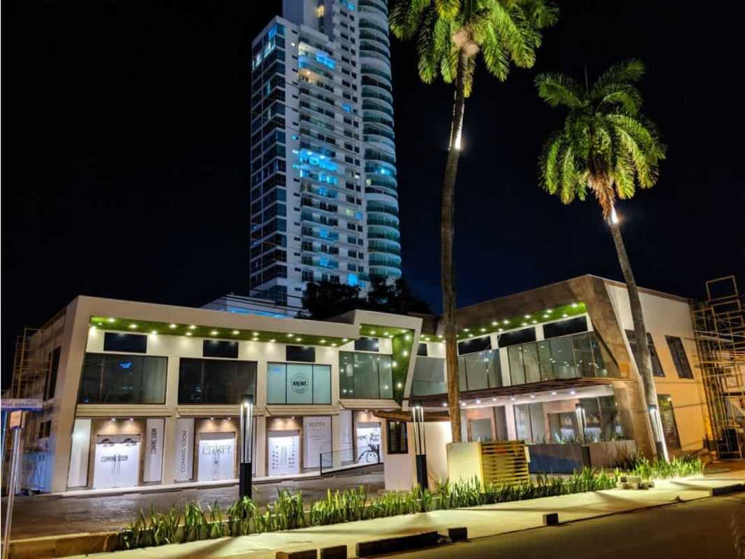 Contemporary commercial building with high-rise tower illuminated at night in San Francisco Panama