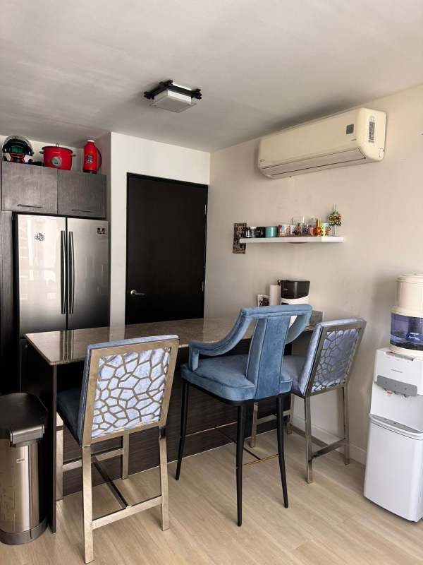 Bathroom with glass-enclosed shower, tropical wallpaper and modern sink in PH Colores Bella Vista Panama