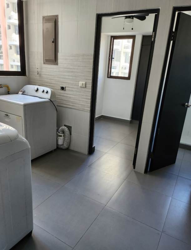 Double-height elegant lobby entrance with reception in PH San Francisco Bay tower Panama City