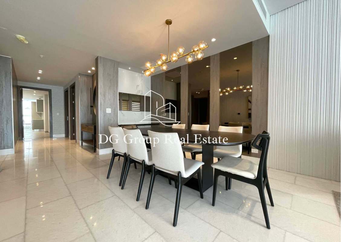 Elegant dining space with marble floors and modern lighting in luxury apartment PH The Towers Panama City