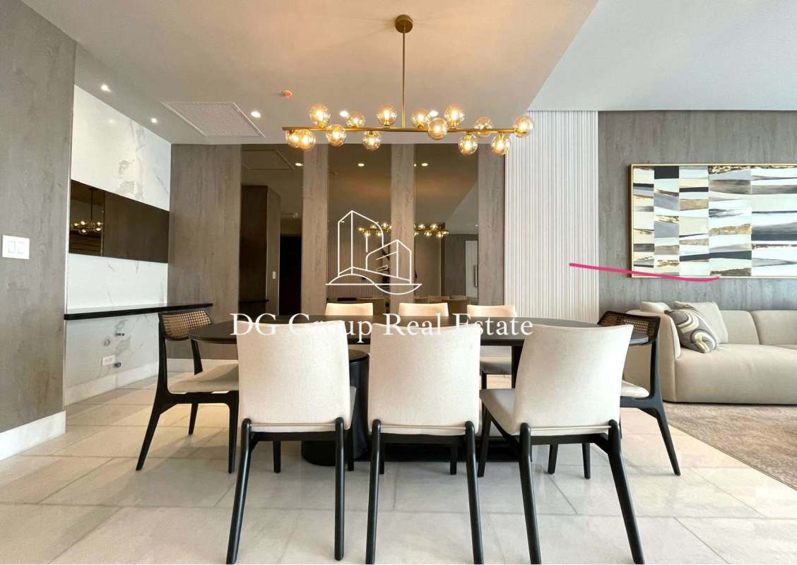 Open plan living and dining with marble floors and modern decor in The Towers Punta Paitilla Panama