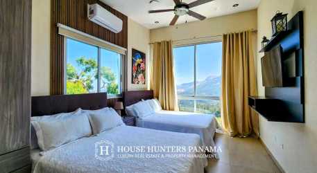 Modern bedroom with balcony mountain views cloud forest Altos del Maria Panama