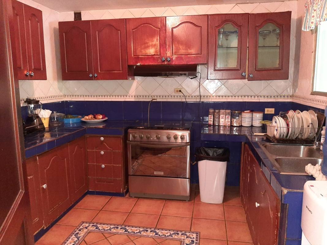 Spacious master bedroom with en-suite bathroom, wood floors in Albrook home