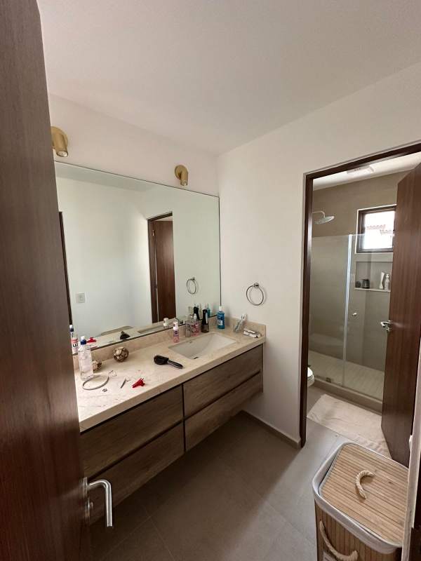 Bathroom with glass enclosed shower and double sink vanity at Golf Gardens Panama City