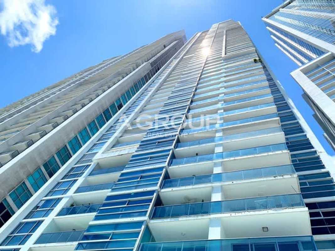 Modern high-rise condominium with glass balconies on Avenida Balboa Panama City