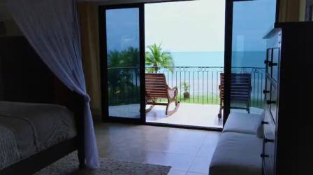 Large modern kitchen with granite countertops and stainless appliances at Buenaventura beachfront villa rental