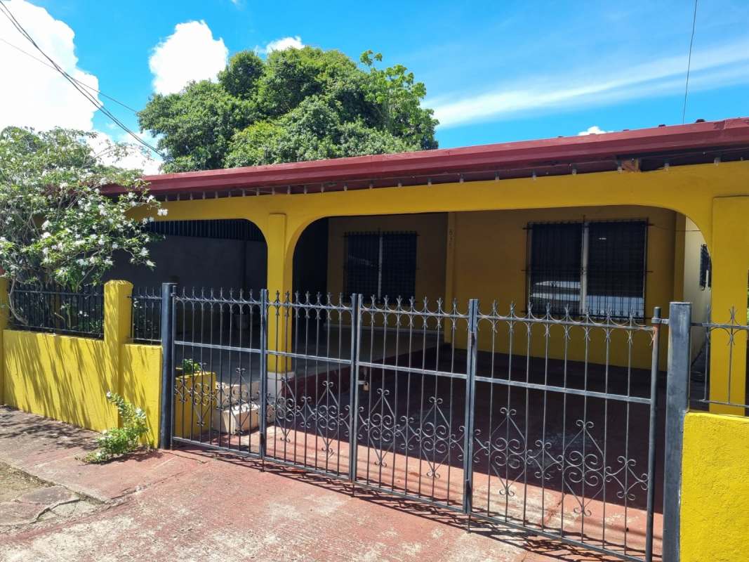 Backyard view with fenced lot and green trees Panama house for sale